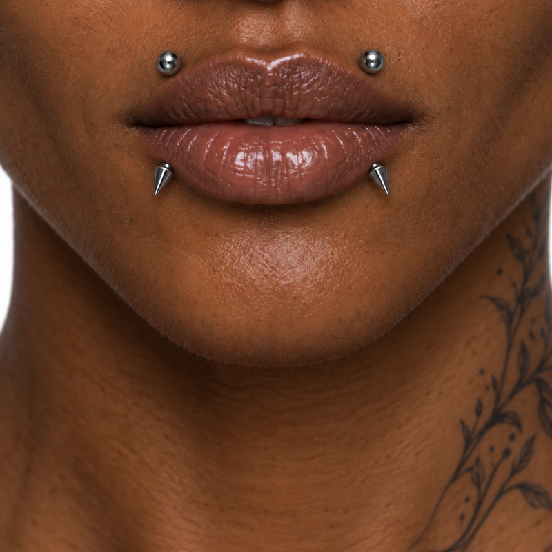 Canine bite piercing jewelry placement