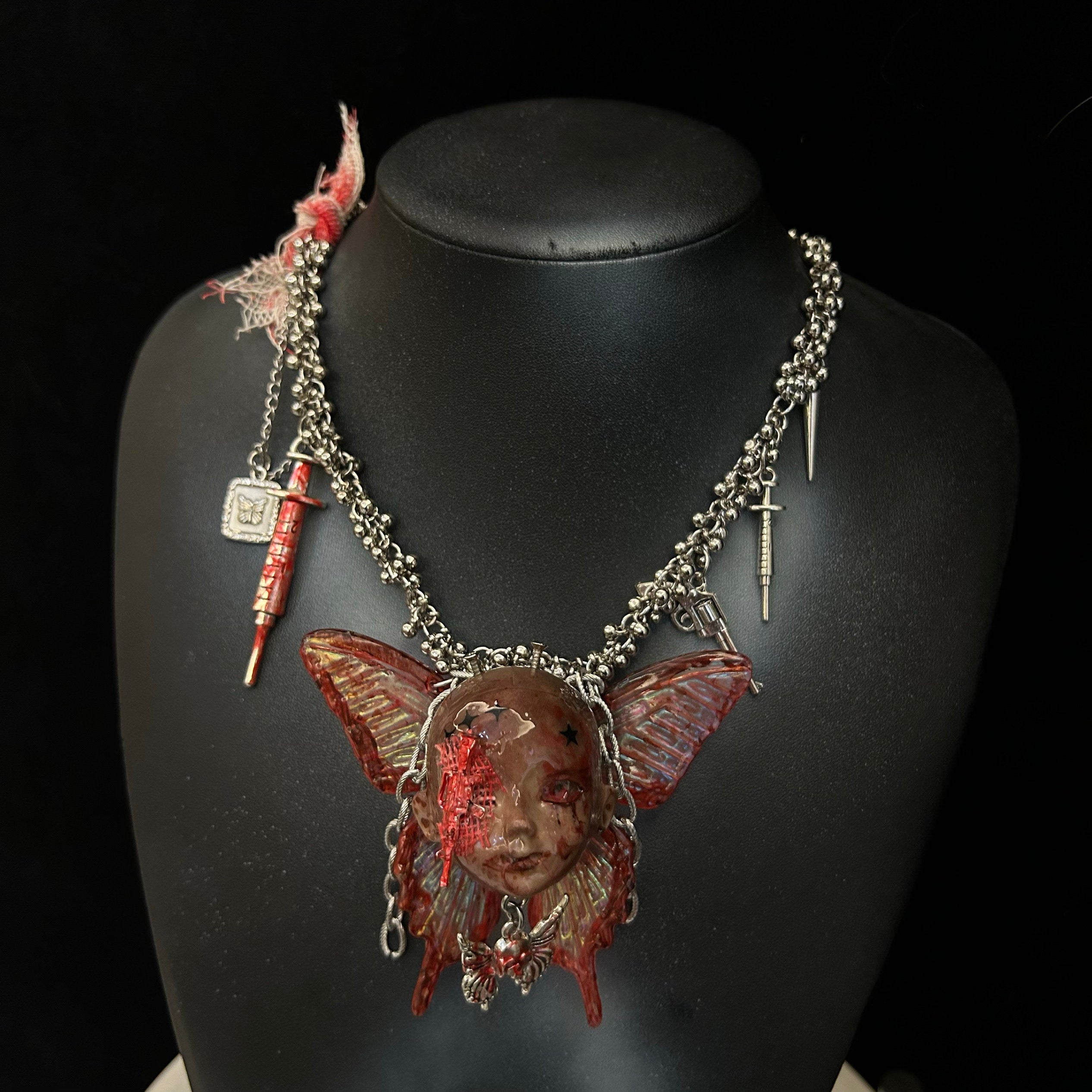 Menhera Bloody Injured Doll Face Necklace with Syringe & Revolver Charms - Red Butterfly Wings