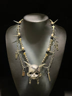 Silver Horned Stitched Doll Face Necklace with Cleaver, Knife & Coffin Charms