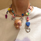Y2K Decora Pink Doll Face Necklace with Smiley Star, Strawberry & Razor Blade Charms