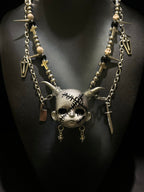 Silver Horned Stitched Doll Face Necklace with Cleaver, Knife & Coffin Charms