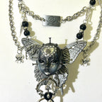 Silver Metallic Butterfly Doll Face Necklace with Rhinestone Heart & Winged Skull Charm