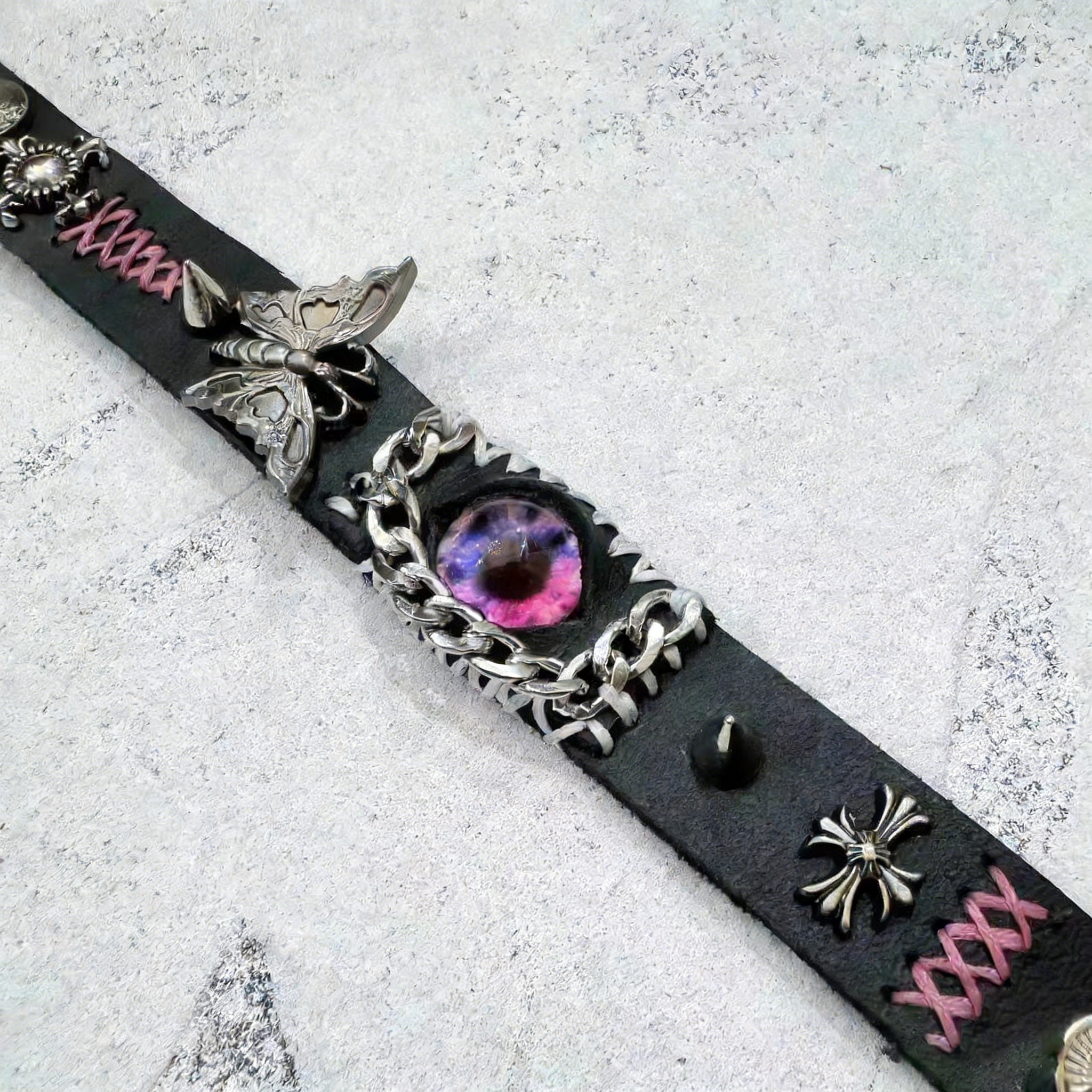 Gothic Black Leather Bracelet with Pink Stitching - Pink Dragon Eye & Silver Moth Cuff - Cross Charm - Pastel Goth Aesthetic