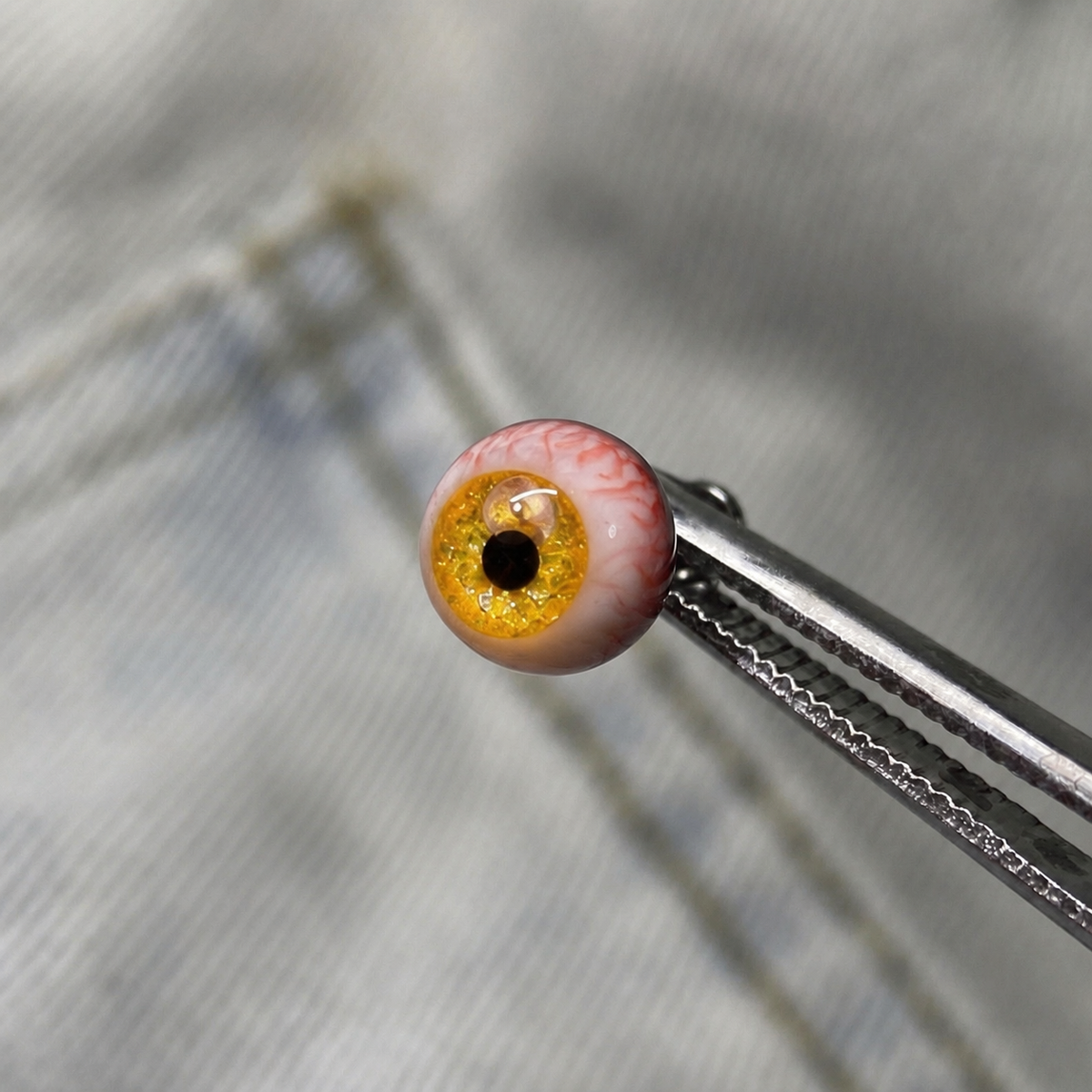 Cthulhu-Auge – Blau-grüner Blick | Ohr-/Lippen-/Zungenpiercings 