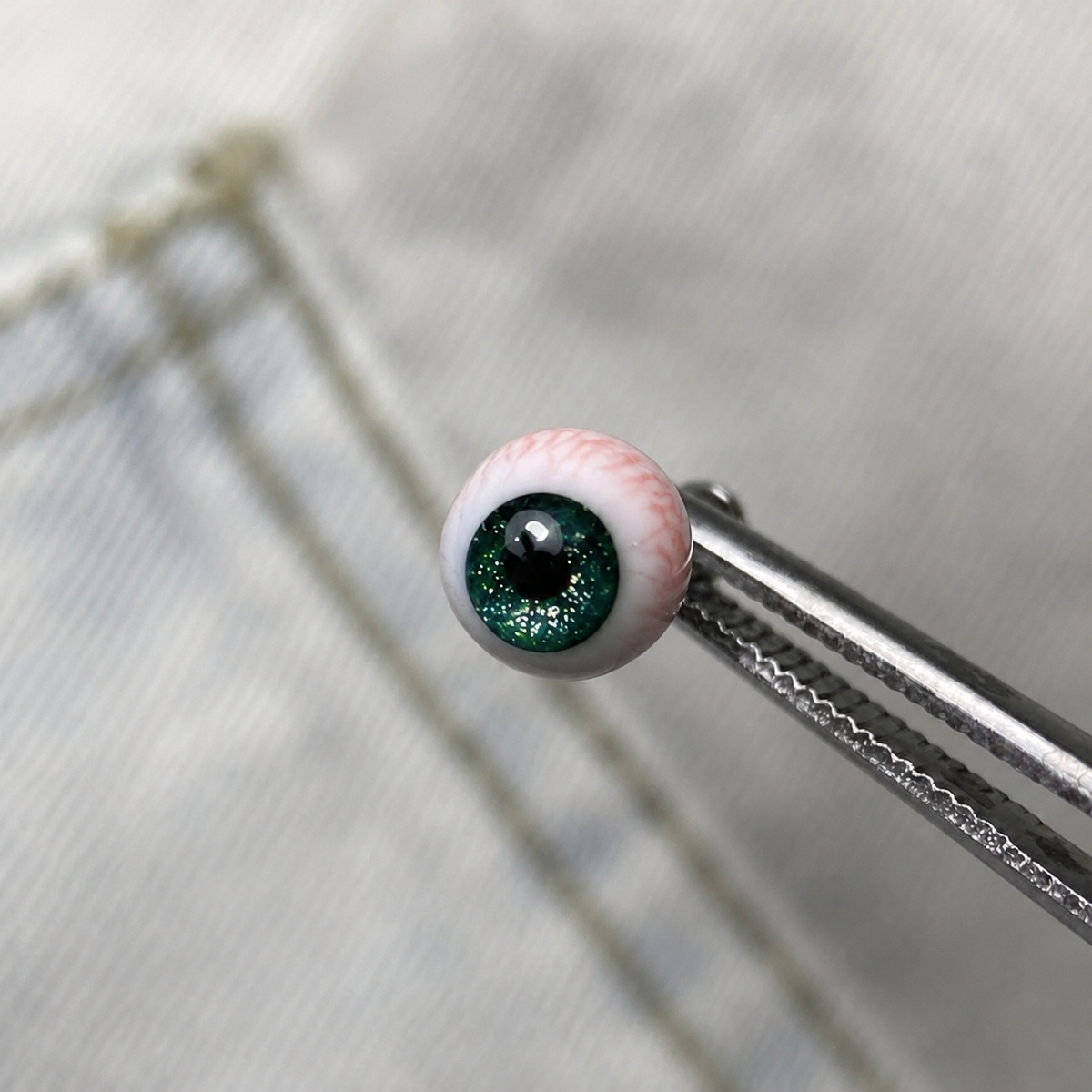 Cthulhu-Auge – Blau-grüner Blick | Ohr-/Lippen-/Zungenpiercings 
