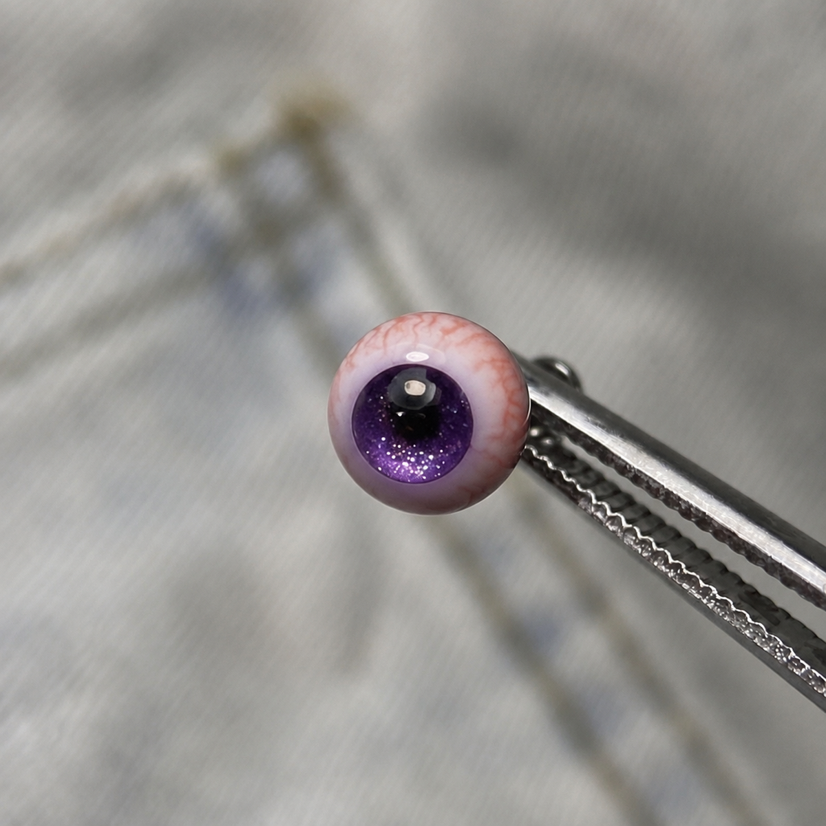Cthulhu-Auge – Blau-grüner Blick | Ohr-/Lippen-/Zungenpiercings 