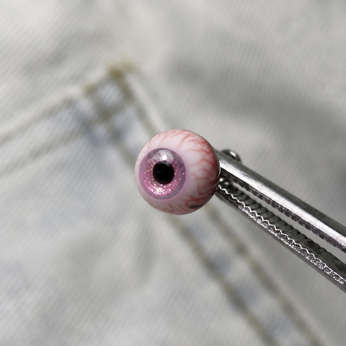 Cthulhu-Auge – Blau-grüner Blick | Ohr-/Lippen-/Zungenpiercings 
