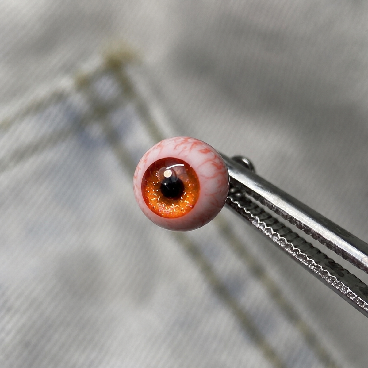 Cthulhu-Auge – Blau-grüner Blick | Ohr-/Lippen-/Zungenpiercings 