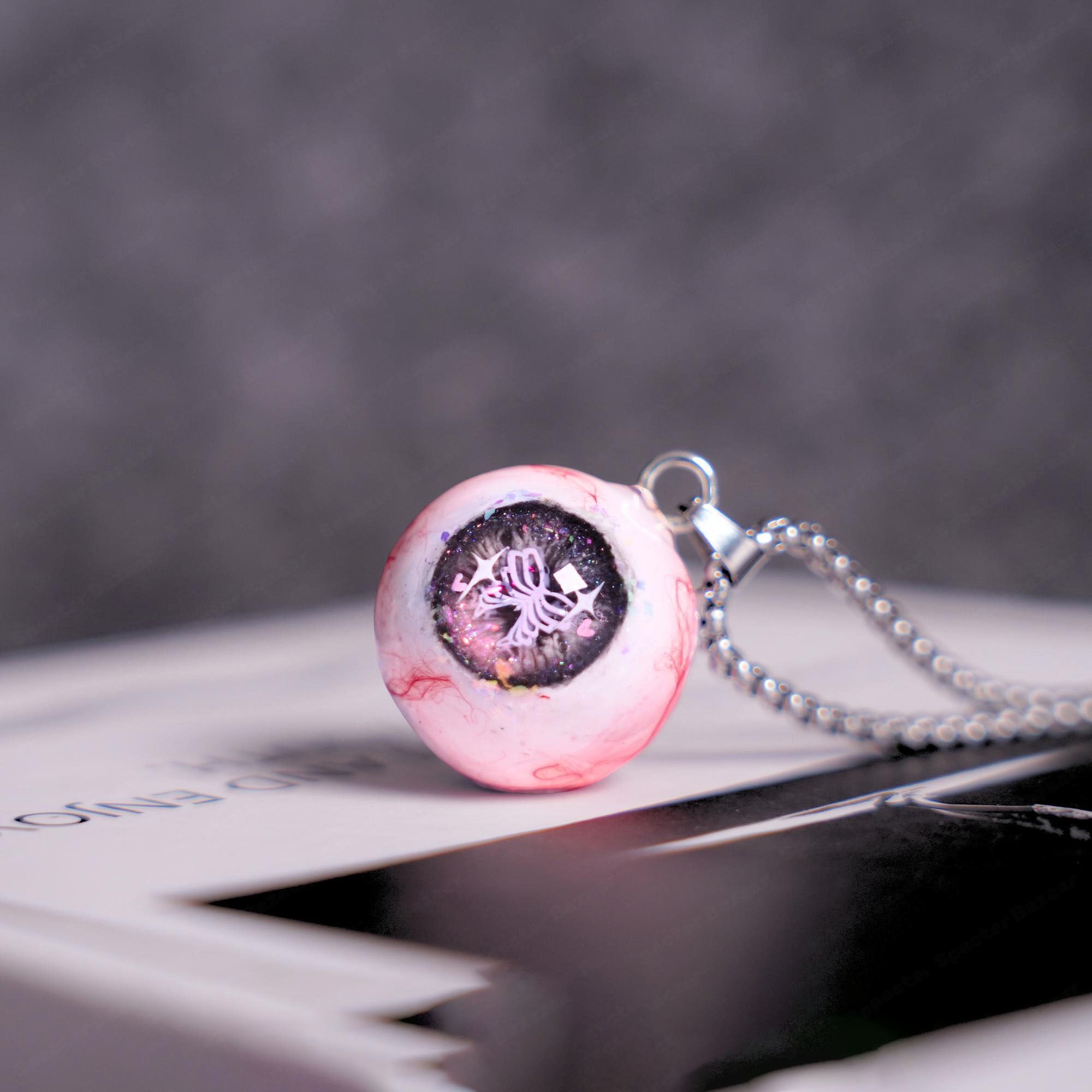 "Pretty Creepy" Coquette Bow Eyeball Necklace - Pink Glitter Ribbon Pupil