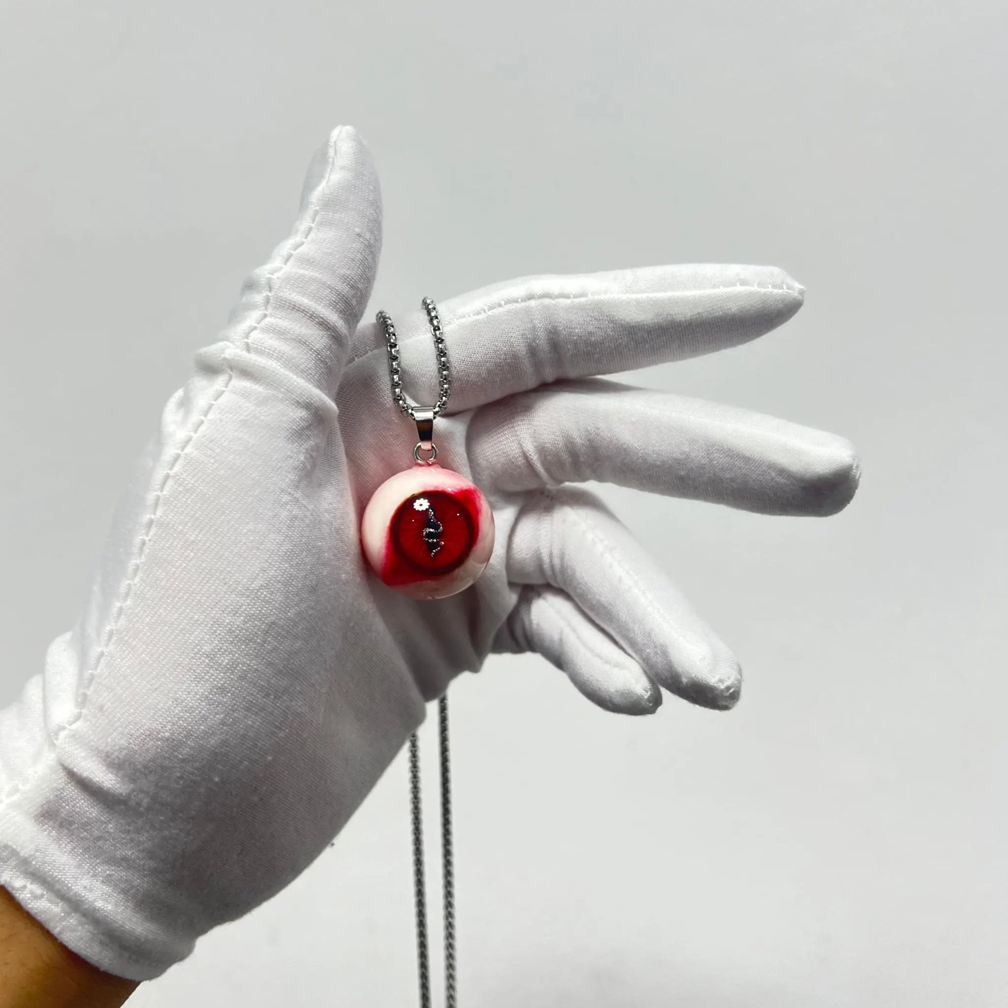 "Forbidden Fruit" Red Snake Eye Necklace - Wavy Pupil & Daisy Detail