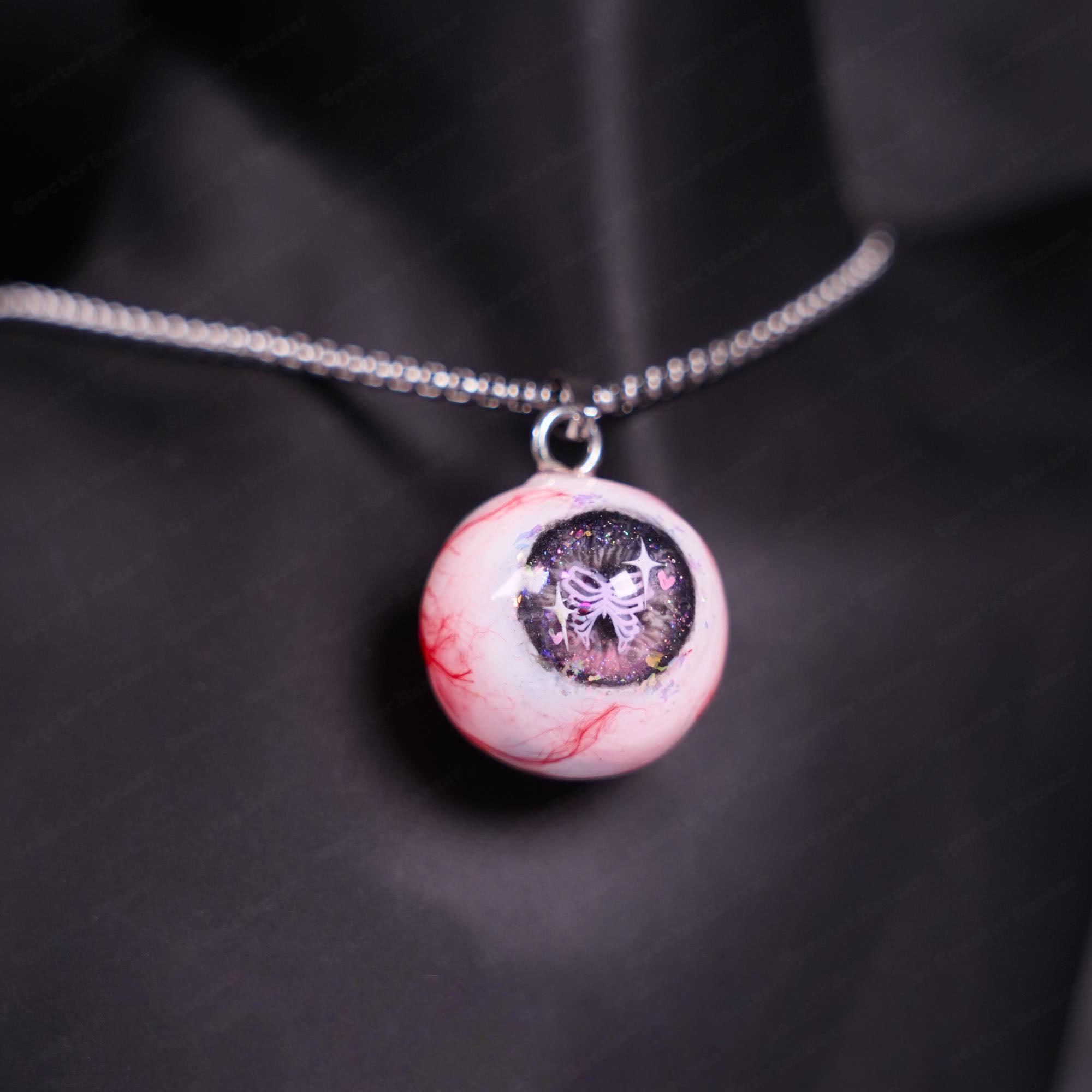 "Pretty Creepy" Coquette Bow Eyeball Necklace - Pink Glitter Ribbon Pupil