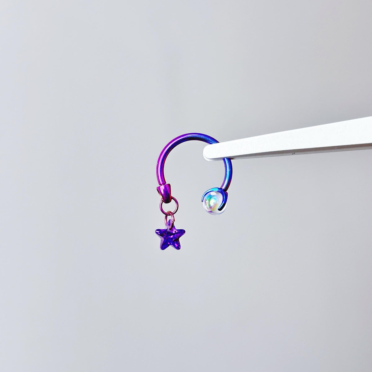 Celestial Dangle Star Titanium Horseshoe Ring detail 6